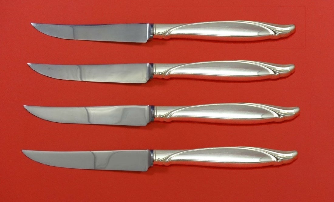 Oneida Sentimental Sterling Silver Steak Knife Set 4pc Custom 8 1/2": Oneida Sentimental Sterling Silver Steak Knife Set 4pc Custom 8 1/2" Enhance your dining experience with this exquisite 4-piece steak knife set from Oneida's Sentimental collection. Crafted from sterl