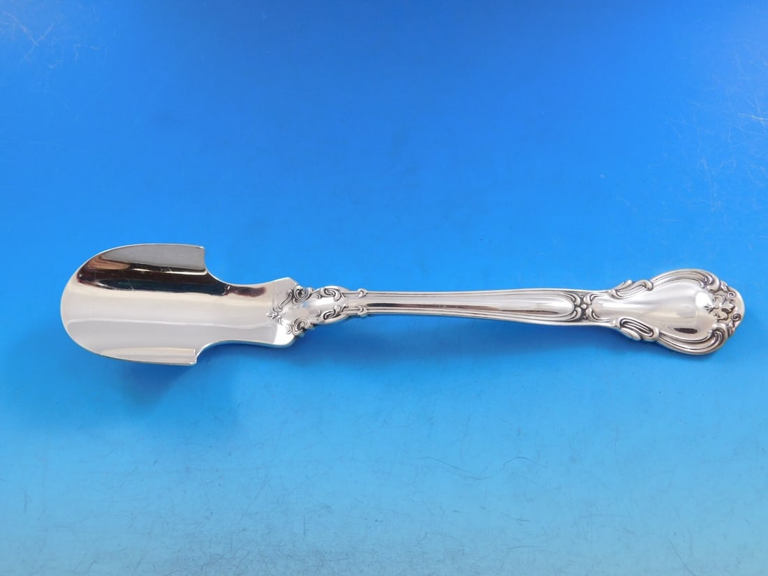 Gorham Chantilly Sterling Silver Large Cheese Scoop 8 1/4": Gorham Chantilly Sterling Silver Large Cheese Scoop 8 1/4" Presenting a large cheese scoop from the Chantilly pattern by Gorham, crafted from sterling silver. This exquisite serving piece measures 8 1