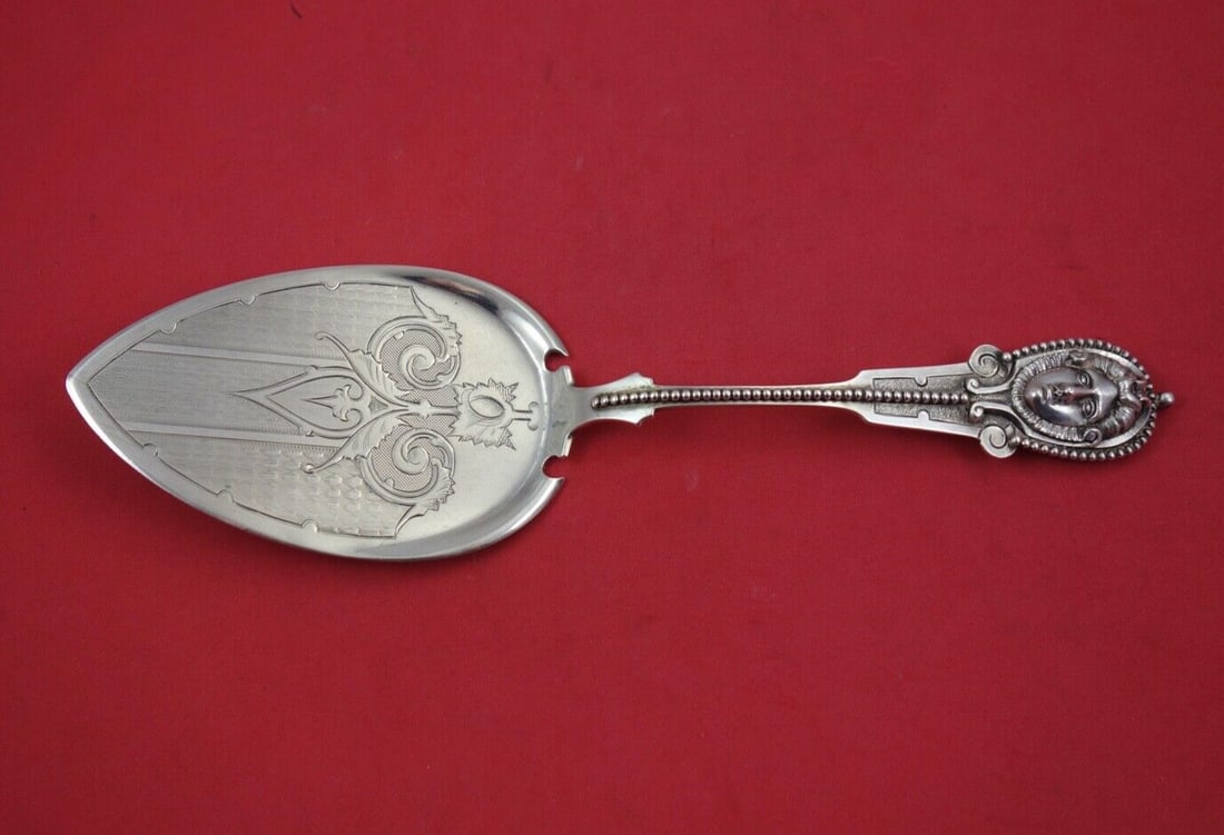 Wood & Hughes Sterling Silver Brite-Cut Pie Server Julia 10 3/8": Wood & Hughes Sterling Silver Brite-Cut Pie Server Julia 10 3/8" This exquisite pie server from Wood & Hughes showcases a beautifully brite-cut blade and a high relief medallion handle featuring a wom