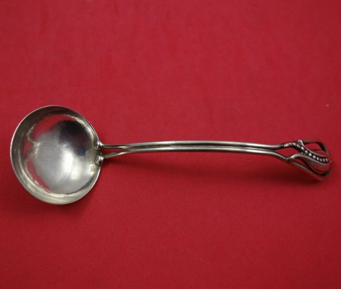 Carl Poul Petersen Peapod Sterling Silver 6 Inch Sauce Ladle: Carl Poul Petersen Peapod Sterling Silver 6 Inch Sauce Ladle This elegant sauce ladle features the Peapod pattern by renowned designer Carl Poul Petersen. Crafted from high-quality sterling silver, th