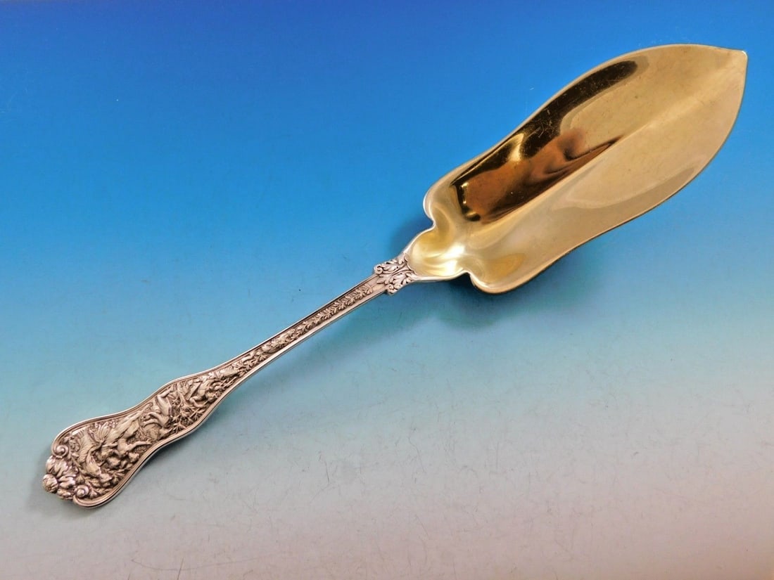 Tiffany & Co Olympian Sterling Silver Trout Server Gold Wash 11 1/4 in: Tiffany & Co Olympian Sterling Silver Trout Server Gold Wash 11 1/4 in Presenting a rare sterling silver trout server from Tiffany & Co., crafted in the exquisite Olympian pattern, introduced in 1878.