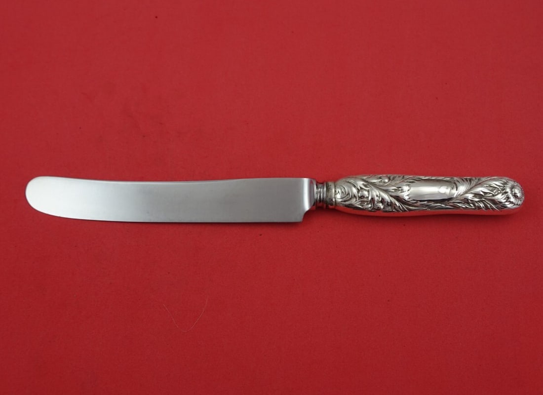 Tiffany & Co Chrysanthemum Sterling Silver Knife 9 1/4": Tiffany & Co Chrysanthemum Sterling Silver Knife 9 1/4" This exquisite knife, part of the iconic Chrysanthemum pattern by Tiffany & Co., showcases the elegance of sterling silver craftsmanship. Design