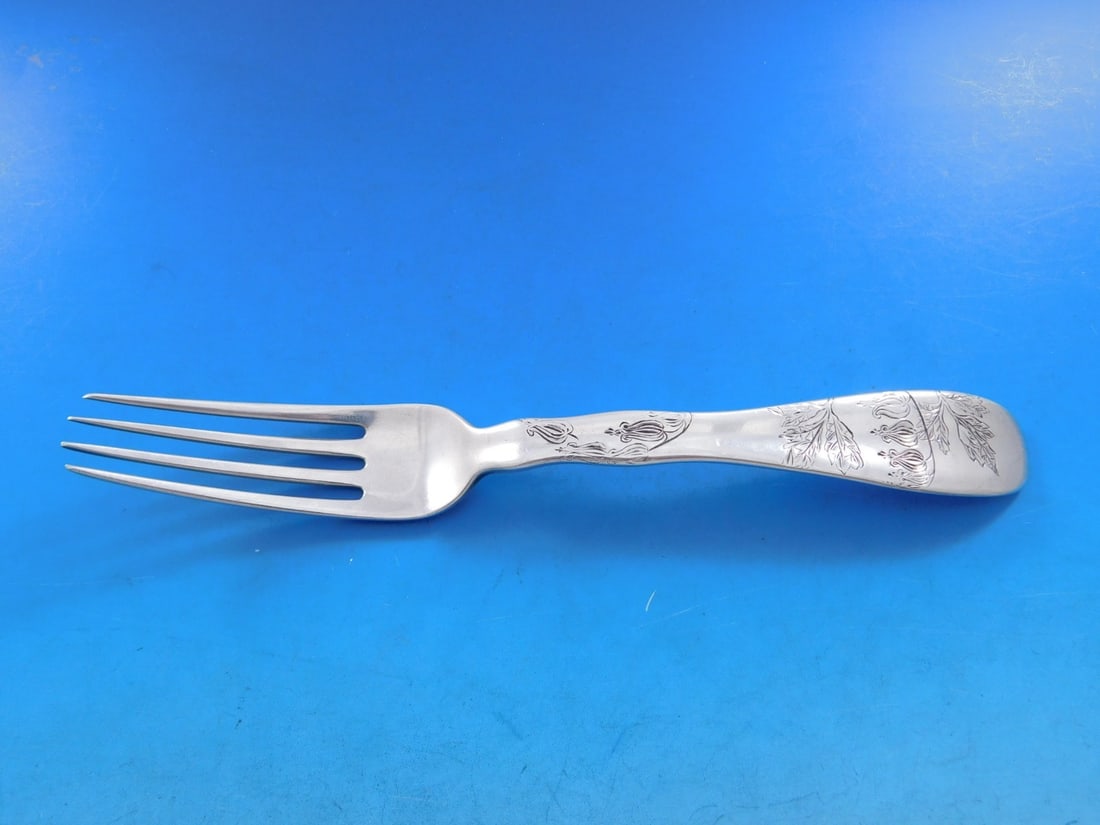Tiffany Sterling Silver Dinner Fork Lap Over Edge Lily Design 7 7/8: Tiffany Sterling Silver Dinner Fork Lap Over Edge Lily Design 7 7/8 Experience elegant dining with this sterling silver dinner fork from Tiffany & Co., featuring the exquisite Lap Over Edge pattern. M