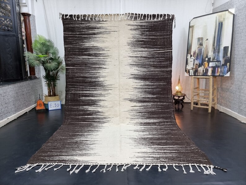 Authentic Handwoven Moroccan Rug 10 x 5 feet: Authentic Handwoven Moroccan Rug 10 x 5 feet This Elegant Authentic Rug is meticulously handwoven in the Atlas Mountains by skilled local Berber women weavers using traditional tools. Crafted from 100