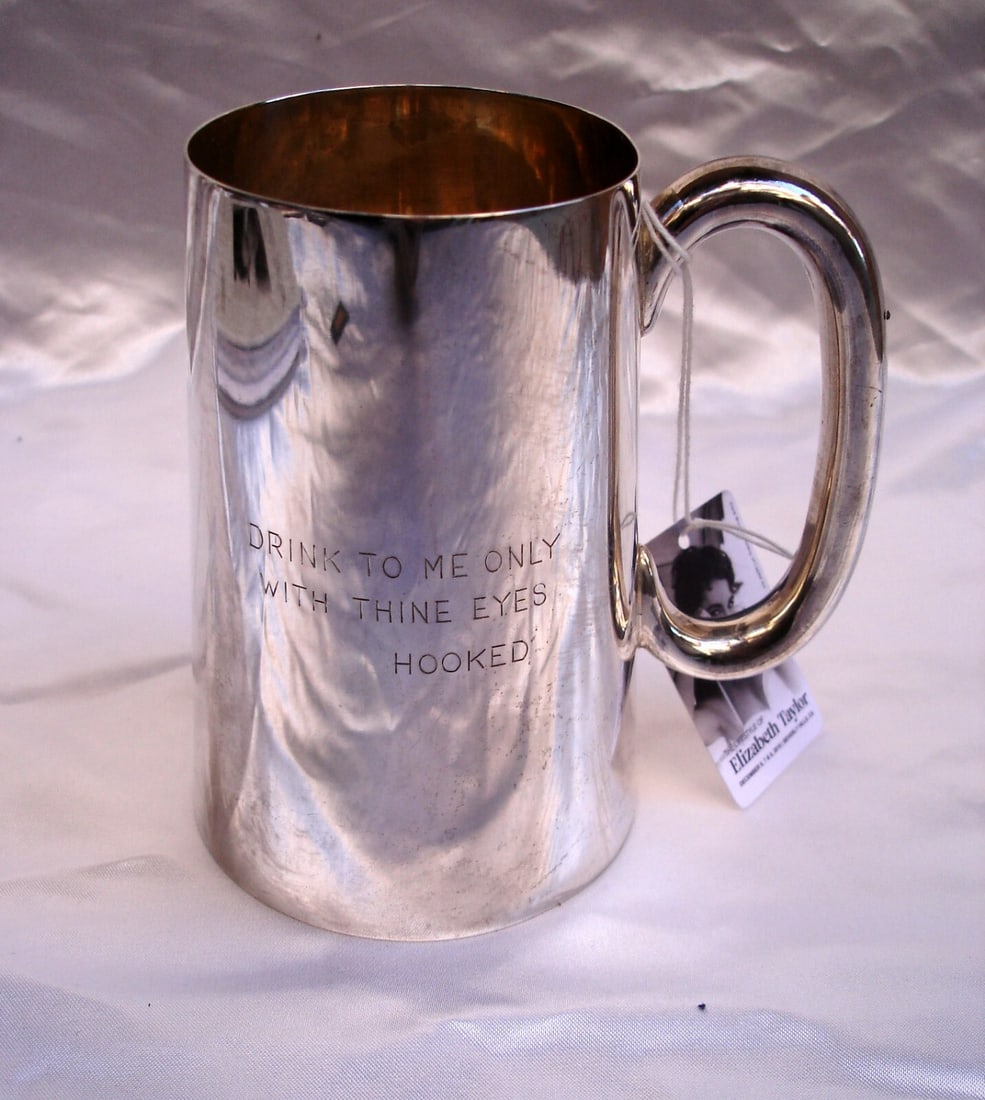 Elizabeth Taylor Dunhill Sterling Silver Tankard 1970 Engraved Gift: Elizabeth Taylor Dunhill Sterling Silver Tankard 1970 Engraved Gift This exquisite English Dunhill sterling silver tankard originates from the estate of the legendary Elizabeth Taylor, crafted by Jame