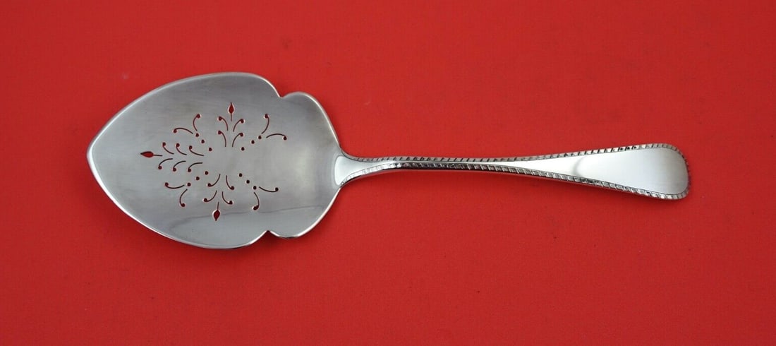 James Robinson Feather Edge Sterling Silver Tomato Server 9.25": James Robinson Feather Edge Sterling Silver Tomato Server 9.25" Enhance your dining experience with this exquisite Sterling Silver Tomato Server from the Feather Edge pattern by James Robinson. Measur
