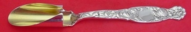 Whiting Heraldic Sterling Silver Cheese Scoop Gold Washed 8 1/8": Whiting Heraldic Sterling Silver Cheese Scoop Gold Washed 8 1/8" This exquisite cheese scoop from the Heraldic by Whiting collection is crafted from sterling silver, featuring a luxurious gold wash fi