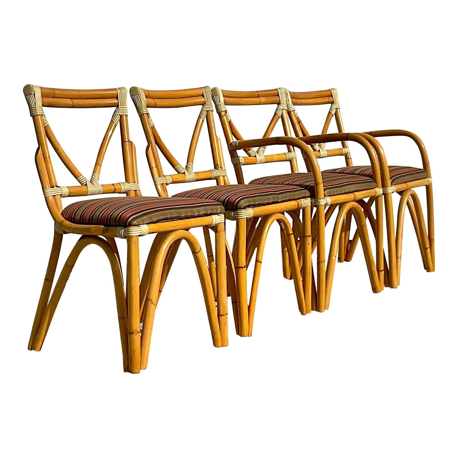 Chic Vintage Coastal Rattan Dining Chairs Set of 4: Chic Vintage Coastal Rattan Dining Chairs Set of 4 Enhance your dining experience with this stunning set of four vintage Coastal dining chairs. Each chair features a unique bent rattan design that add