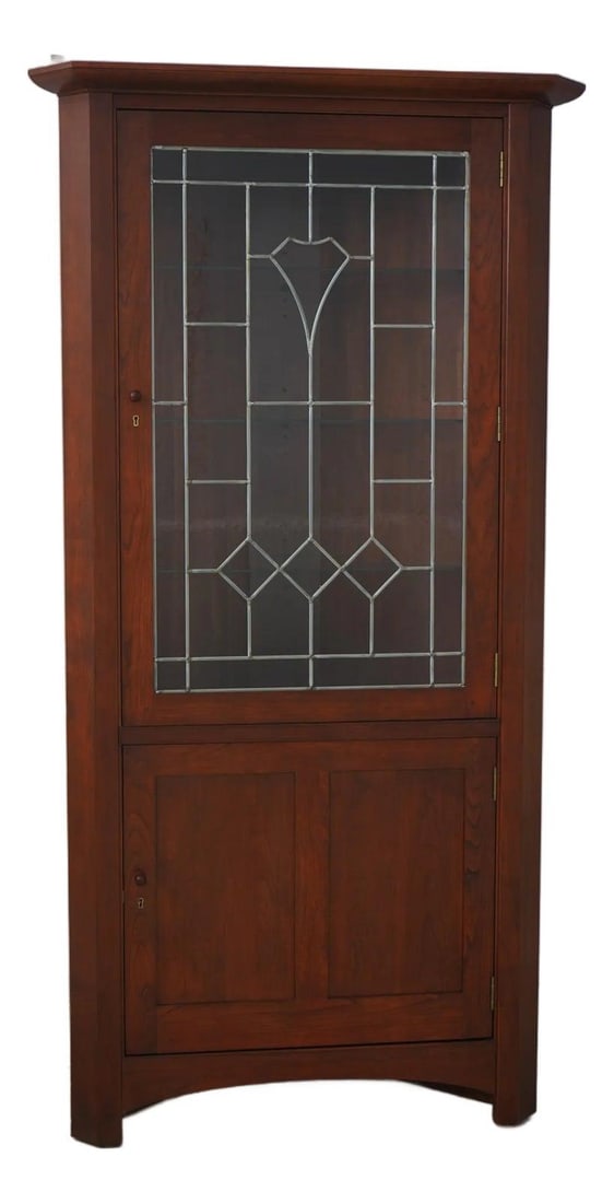 Stickley Arts & Crafts Mission Cherry Wood Corner Cabinet: Stickley Arts & Crafts Mission Cherry Wood Corner Cabinet This Stickley Arts & Crafts Mission Cherry Corner Cabinet embodies timeless craftsmanship and quality. Crafted around 2008, this cabinet featu
