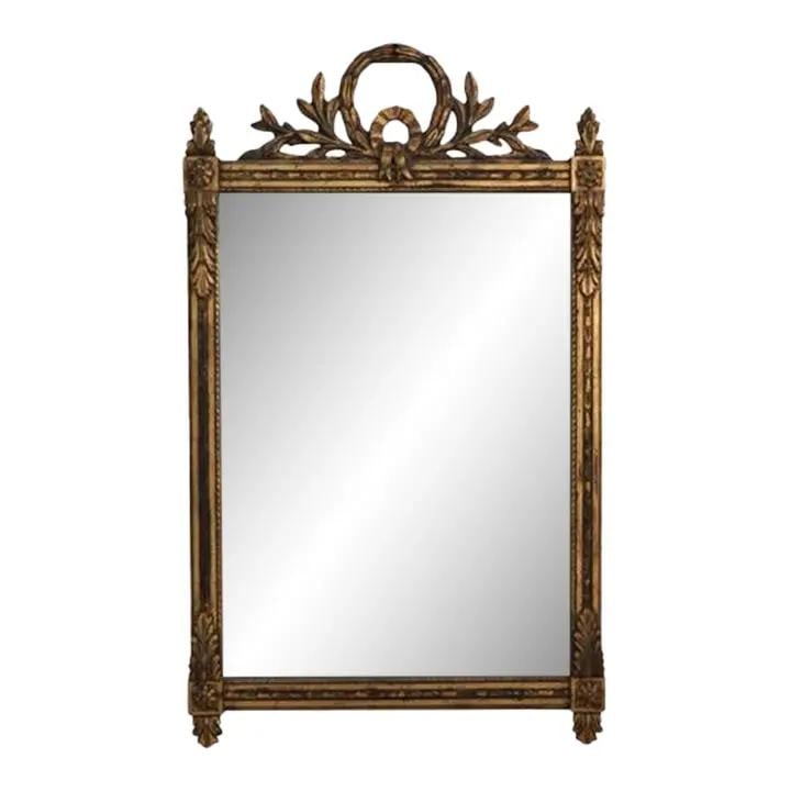 Vintage Regency Wreath Carved Gold Frame Mirror 30.5 x 51.5: Vintage Regency Wreath Carved Gold Frame Mirror 30.5 x 51.5 This vintage Regency style mirror features a beautifully carved wreath crest and an ornate frame finished in a lovely aged gold. With its ex