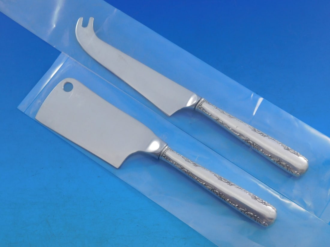 Gorham Camellia Sterling Silver 2pc Cheese Serving Set: Gorham Camellia Sterling Silver 2pc Cheese Serving Set This exquisite 2-piece cheese serving set by Gorham features the elegant Camellia pattern, influenced by the grace of 18th century France. Crafte