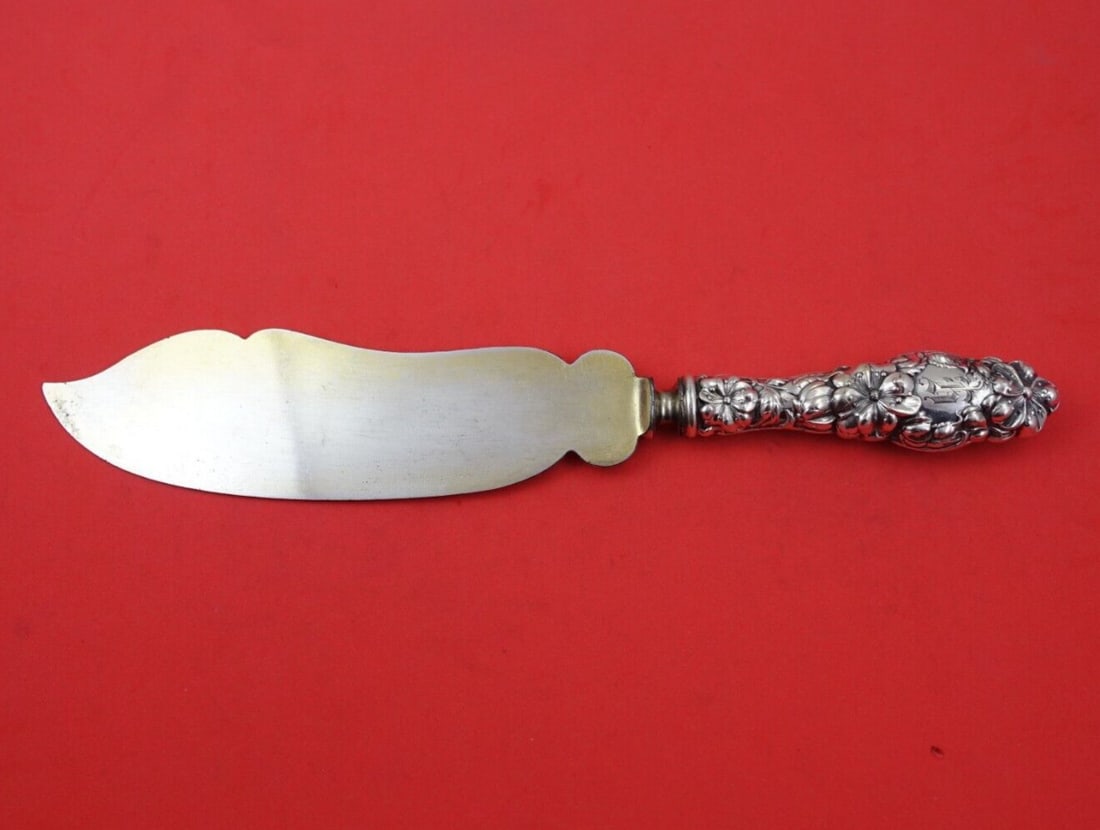 Dominick & Haff Blossom Sterling Silver Ice Cream Slice 10 3/8 in: Dominick & Haff Blossom Sterling Silver Ice Cream Slice 10 3/8 in Experience the elegance of the Blossom ice cream slice crafted by Dominick & Haff. This exquisite serving piece features a sterling si