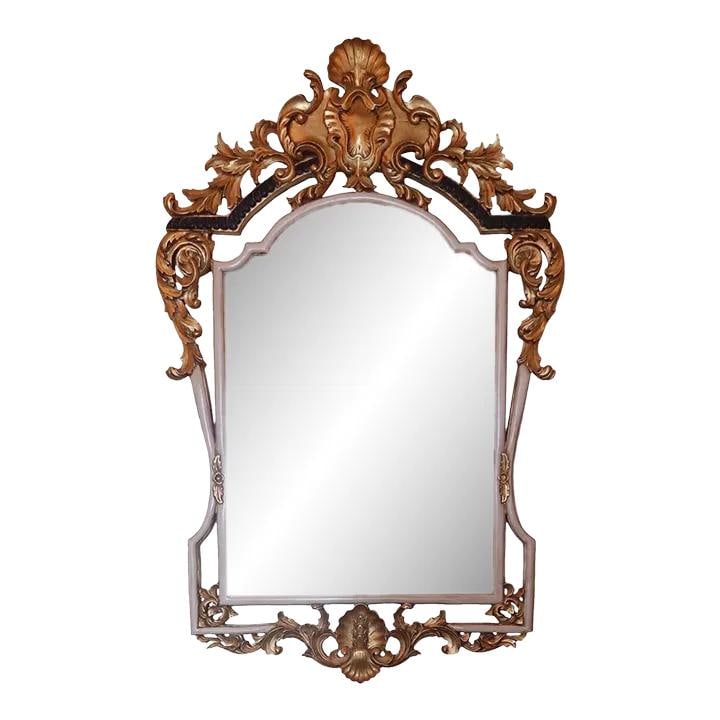 Elegant French Louis XIV Style Carved Mirror with Gold Gilt Finish: Elegant French Louis XIV Style Carved Mirror with Gold Gilt Finish This exquisite French Louis XIV style mirror features a finely carved wood frame adorned with a custom painted and gold gilt finish.