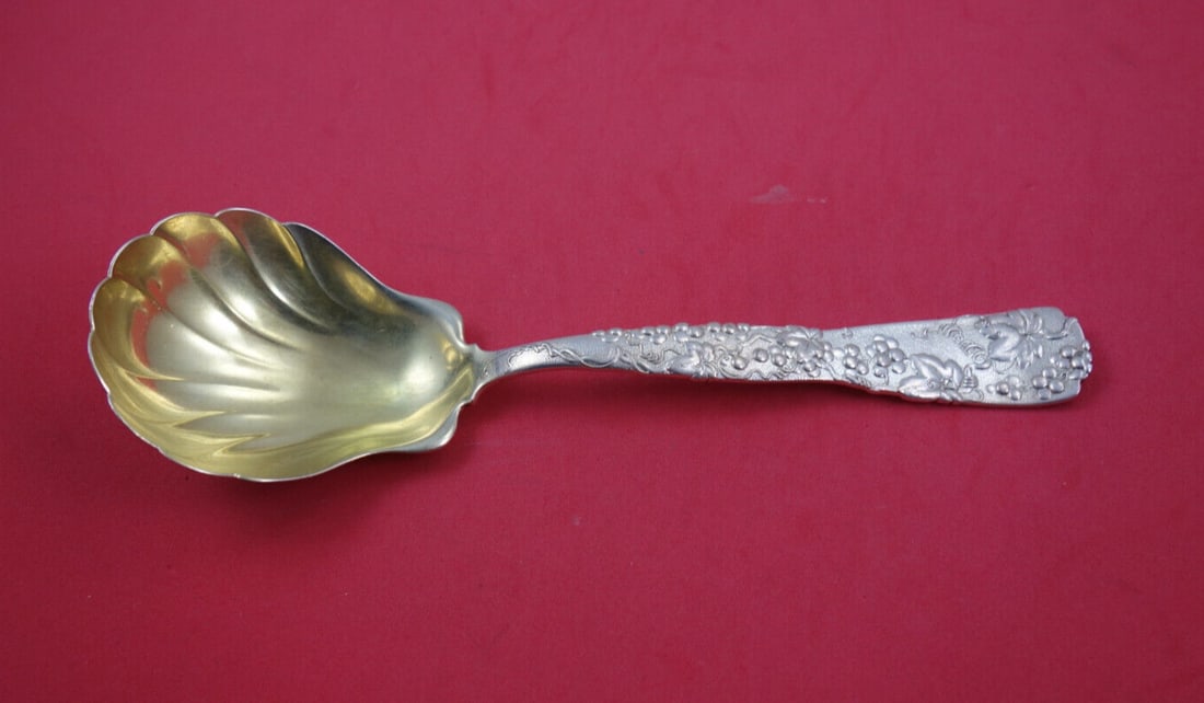Tiffany & Co. Vine Sterling Silver Berry Spoon 9.25" Gold-Washed Scalloped Bowl: Tiffany & Co. Vine Sterling Silver Berry Spoon 9.25" Gold-Washed Scalloped Bowl This exquisite serving spoon, part of the Vine collection by Tiffany & Co., showcases a stunning gold-washed scalloped b