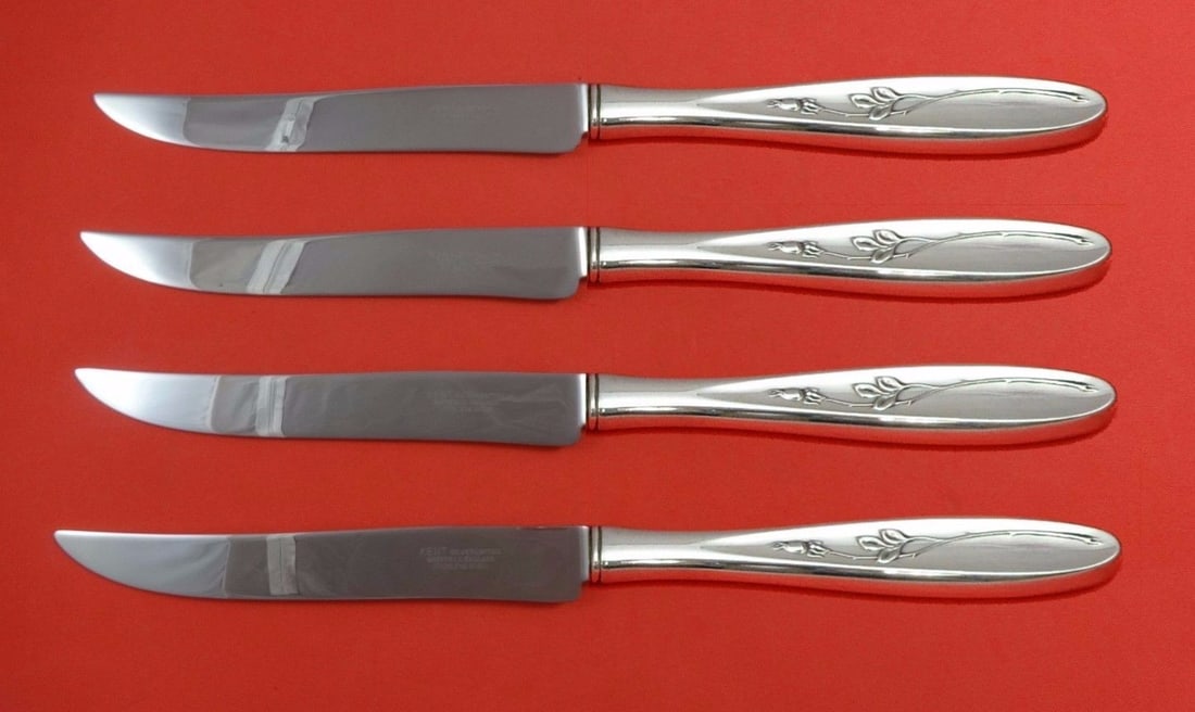 Towle Rose Solitaire Sterling Silver 4pc Texas Sized Steak Knife Set: Towle Rose Solitaire Sterling Silver 4pc Texas Sized Steak Knife Set Introducing the Rose Solitaire Sterling Silver Steak Knife Set by Towle, a stunning 4-piece flatware collection designed for those
