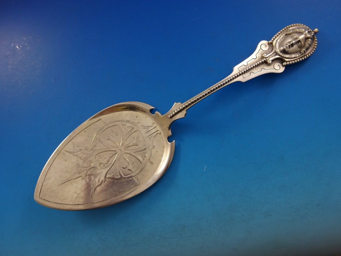 Victorian Wood & Hughes Medallion Sterling Silver Pie Server 10 3/8": Victorian Wood & Hughes Medallion Sterling Silver Pie Server 10 3/8" Discover the exquisite beauty of this Victorian-style pie server from the renowned Wood & Hughes, crafted in the Medallion pattern.