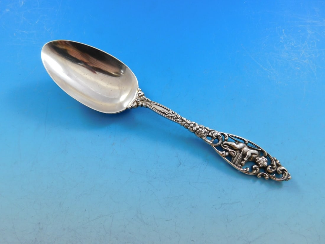Dominick & Haff Labors of Cupid Sterling Silver Child's Spoon 6 3/8": Dominick & Haff Labors of Cupid Sterling Silver Child's Spoon 6 3/8" This exquisite sterling silver child's spoon features the elegant 'Labors of Cupid' pattern by Dominick & Haff. Measuring 6 3/8 inc