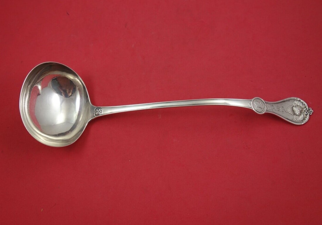 Durgin Strawberry Coin Silver Soup Ladle 11 3/4 inches: Durgin Strawberry Coin Silver Soup Ladle 11 3/4 inches This exquisite soup ladle is crafted from coin silver and features the elegant Strawberry pattern by Durgin, dating back to 1850-1899. Measuring