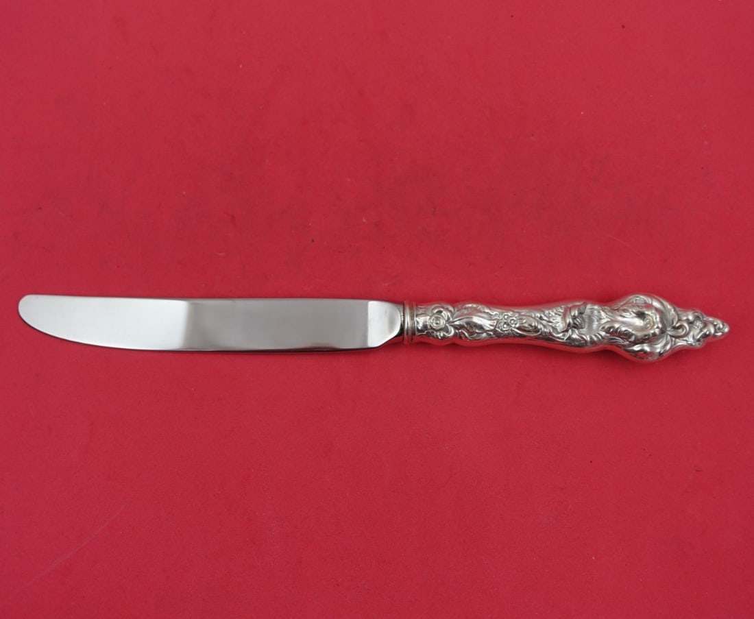 Reed and Barton Les Six Fleurs Sterling Silver Dinner Knife 9 3/4": Reed and Barton Les Six Fleurs Sterling Silver Dinner Knife 9 3/4" This exquisite dinner knife features the Les Six Fleurs pattern by Reed and Barton, renowned for its elegant design. Crafted from hig