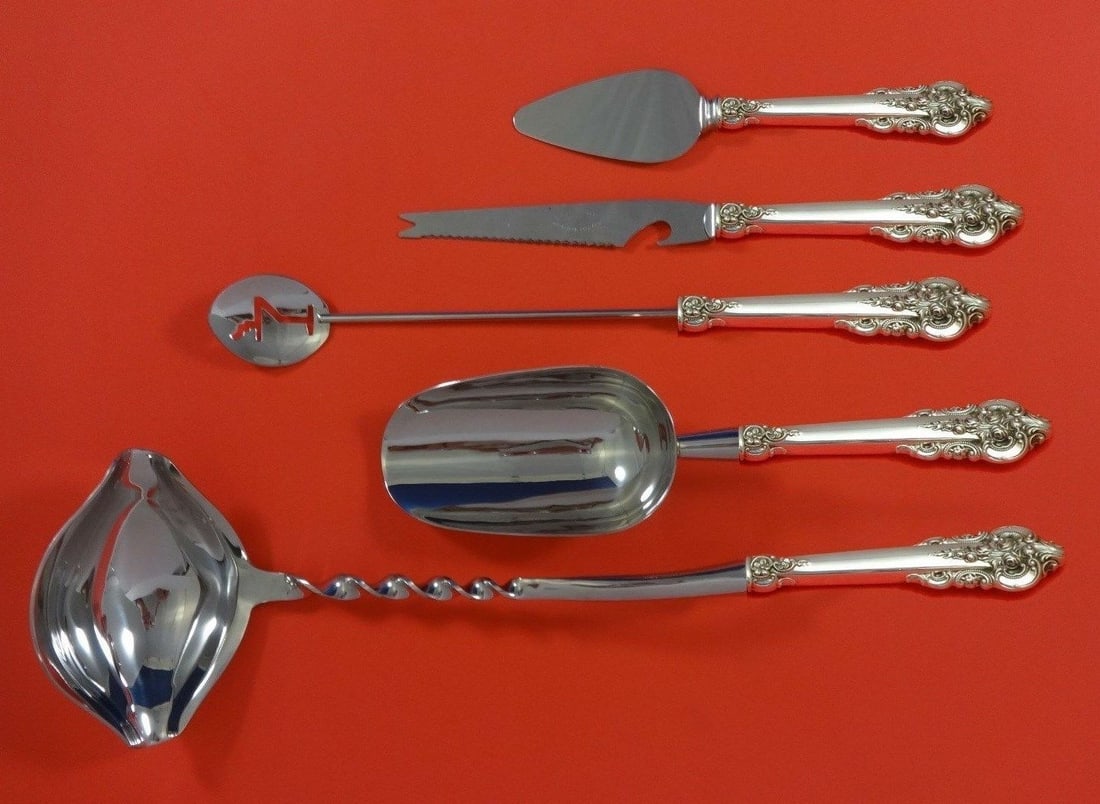 Grande Baroque Wallace Sterling Silver 5pc Cocktail Party Set: Grande Baroque Wallace Sterling Silver 5pc Cocktail Party Set Elevate your entertaining experience with the Grande Baroque Sterling Silver Cocktail Party Bar Set. This exquisite 5-piece hostess set, c