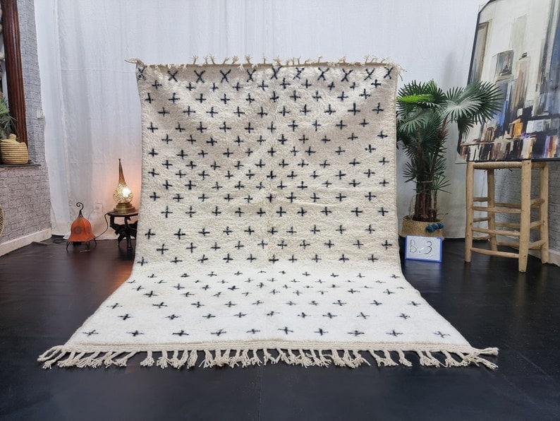 Handmade Moroccan Berber Wool Area Rug 9.84 x 6.56 Feet: Handmade Moroccan Berber Wool Area Rug 9.84 x 6.56 Feet Transform your space with this stunning Soft White & Black Handmade Moroccan Berber Wool Area Rug. Handwoven in the Atlas Mountains by skilled l