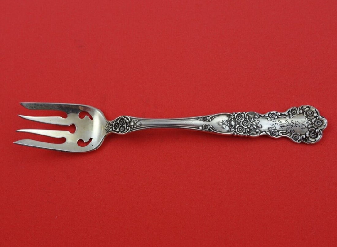 Gorham Buttercup Sterling Silver Ramekin Fork 5 1/8" with Two Piercings: Gorham Buttercup Sterling Silver Ramekin Fork 5 1/8" with Two Piercings This exquisite Buttercup ramekin fork by Gorham showcases the timeless elegance of sterling silver craftsmanship. With its delic