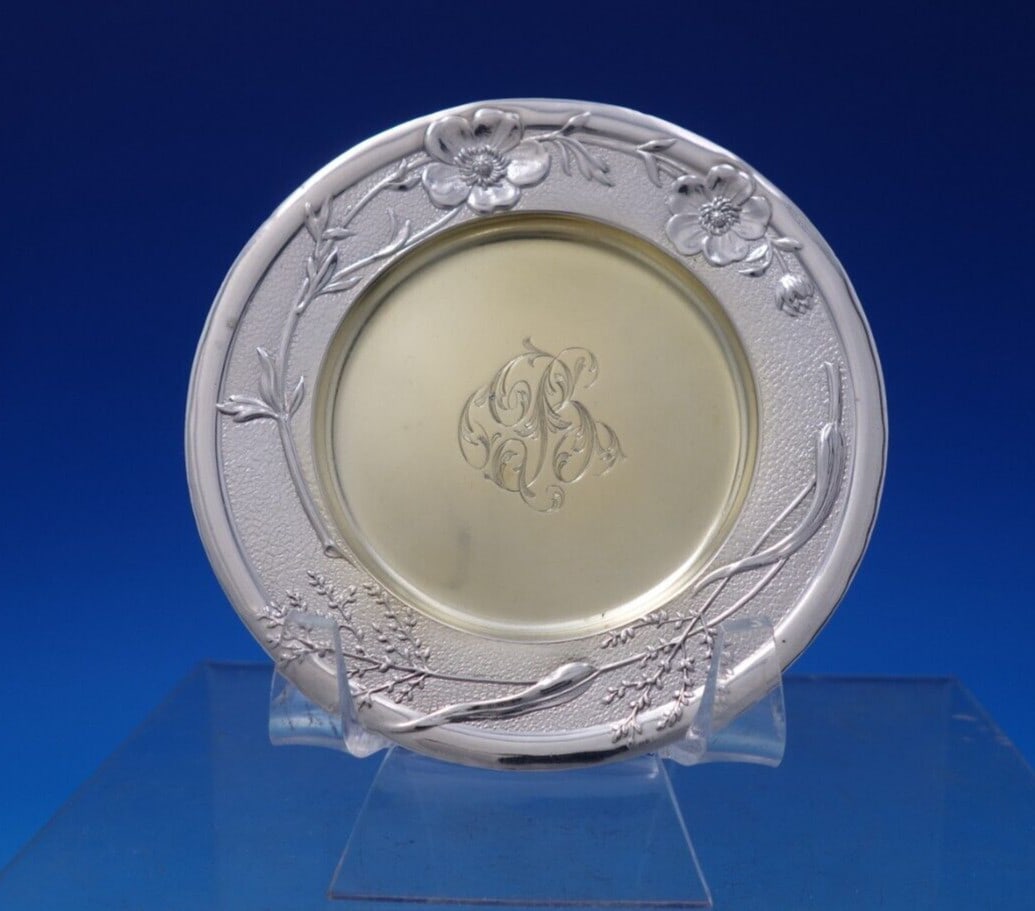 Tiffany & Co Vine Sterling Silver Butter Pat with Wild Rose Motif: Tiffany & Co Vine Sterling Silver Butter Pat with Wild Rose Motif This exquisite butter pat from Tiffany & Co. features the elegant Vine pattern, adorned with a delicate wild rose motif and a luxuriou