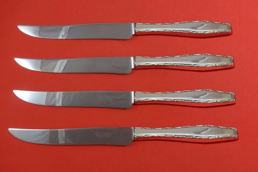 Lunt Rapallo Sterling Silver 4pc Texas Sized Steak Knife Set: Lunt Rapallo Sterling Silver 4pc Texas Sized Steak Knife Set Introducing the Rapallo by Lunt Sterling Silver Steak Knife Set, a luxurious and practical addition to your flatware collection. This impre
