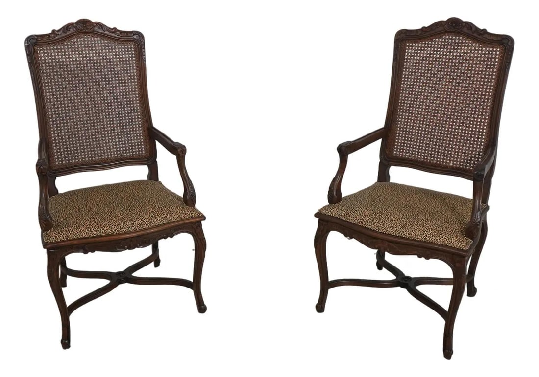Elegant Pair of French Louis XV Cheetah Print Cane Back Armchairs: Elegant Pair of French Louis XV Cheetah Print Cane Back Armchairs This exquisite pair of French Louis XV armchairs features a striking cheetah print upholstery, bringing a touch of elegance and wild s