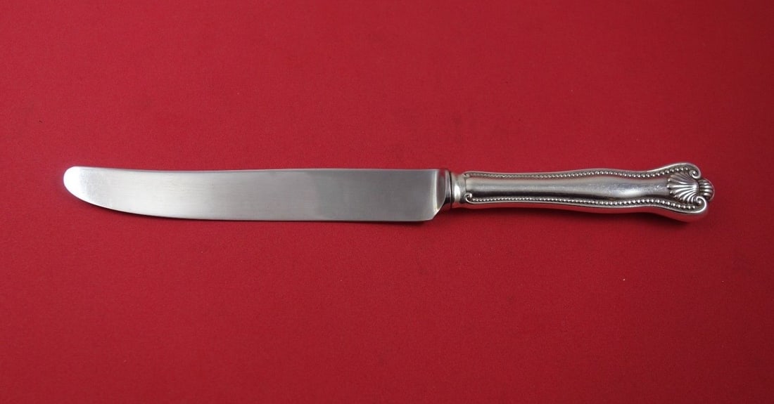 Frank Smith Newport Shell Sterling Silver Dinner Knife 9 3/8": Frank Smith Newport Shell Sterling Silver Dinner Knife 9 3/8" This exquisite dinner knife features the Newport Shell pattern by Frank Smith, crafted from high-quality sterling silver. The knife has a