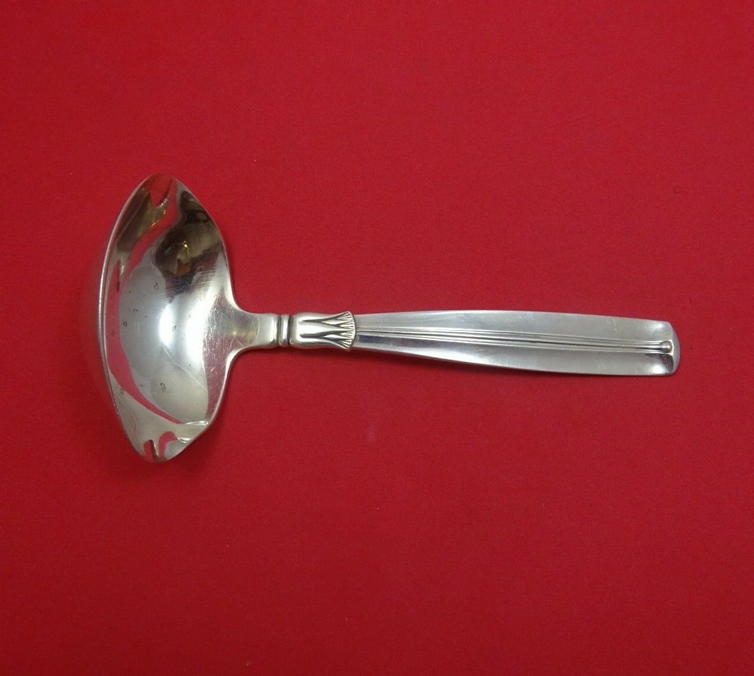 W and S Sorensen Lotus Sterling Silver Gravy Ladle 7 Inch with Spouts: W and S Sorensen Lotus Sterling Silver Gravy Ladle 7 Inch with Spouts Add a touch of elegance to your dining experience with this stunning 7" gravy ladle from the Lotus pattern by W and S Sorensen. Cr