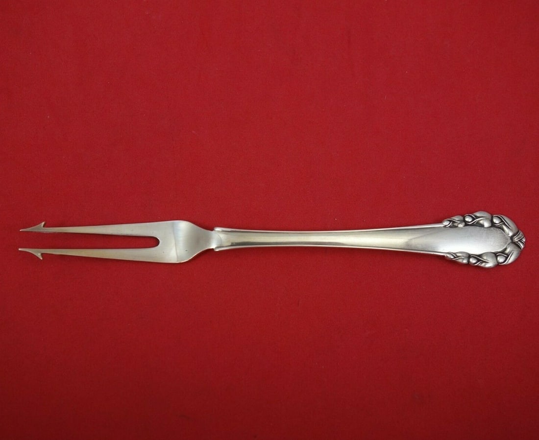 Georg Jensen Lily of the Valley Sterling Silver Hors D' Oeuvre Fork with Barbs: Georg Jensen Lily of the Valley Sterling Silver Hors D' Oeuvre Fork with Barbs Discover the elegance of this "Lily of the Valley" Hors D' Oeuvre Fork by Georg Jensen, crafted in luxurious sterling sil