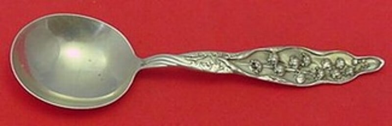 Whiting Lily of the Valley Sterling Silver Gumbo Spoon 6 7/8 Antique: Whiting Lily of the Valley Sterling Silver Gumbo Spoon 6 7/8 Antique This exquisite gumbo soup spoon, crafted by Whiting, showcases the elegant Lily of the Valley pattern, patented in 1885. The spoon
