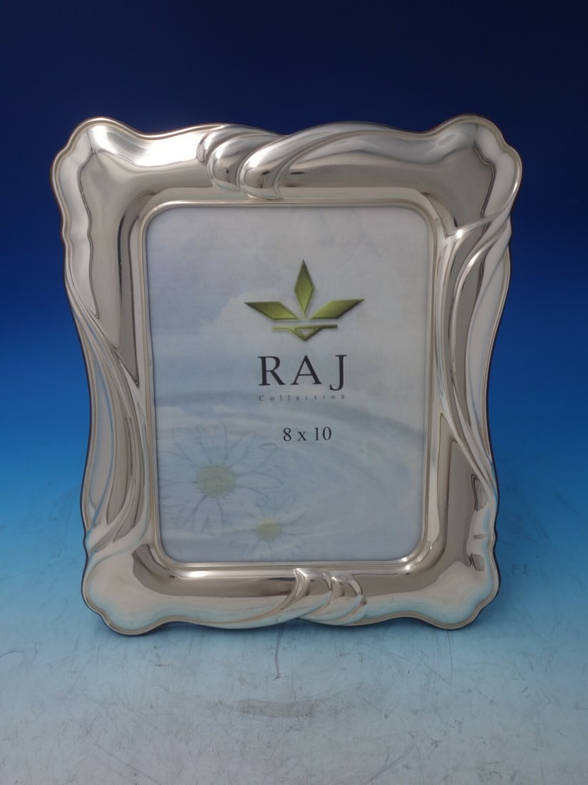 Elegant Argento Sterling Silver RAJ Collection 8 x 10 Frame: Elegant Argento Sterling Silver RAJ Collection 8 x 10 Frame Showcase your cherished memories in this exquisite Argento Italian Sterling Silver Picture Frame from the RAJ Collection. Designed to hold a