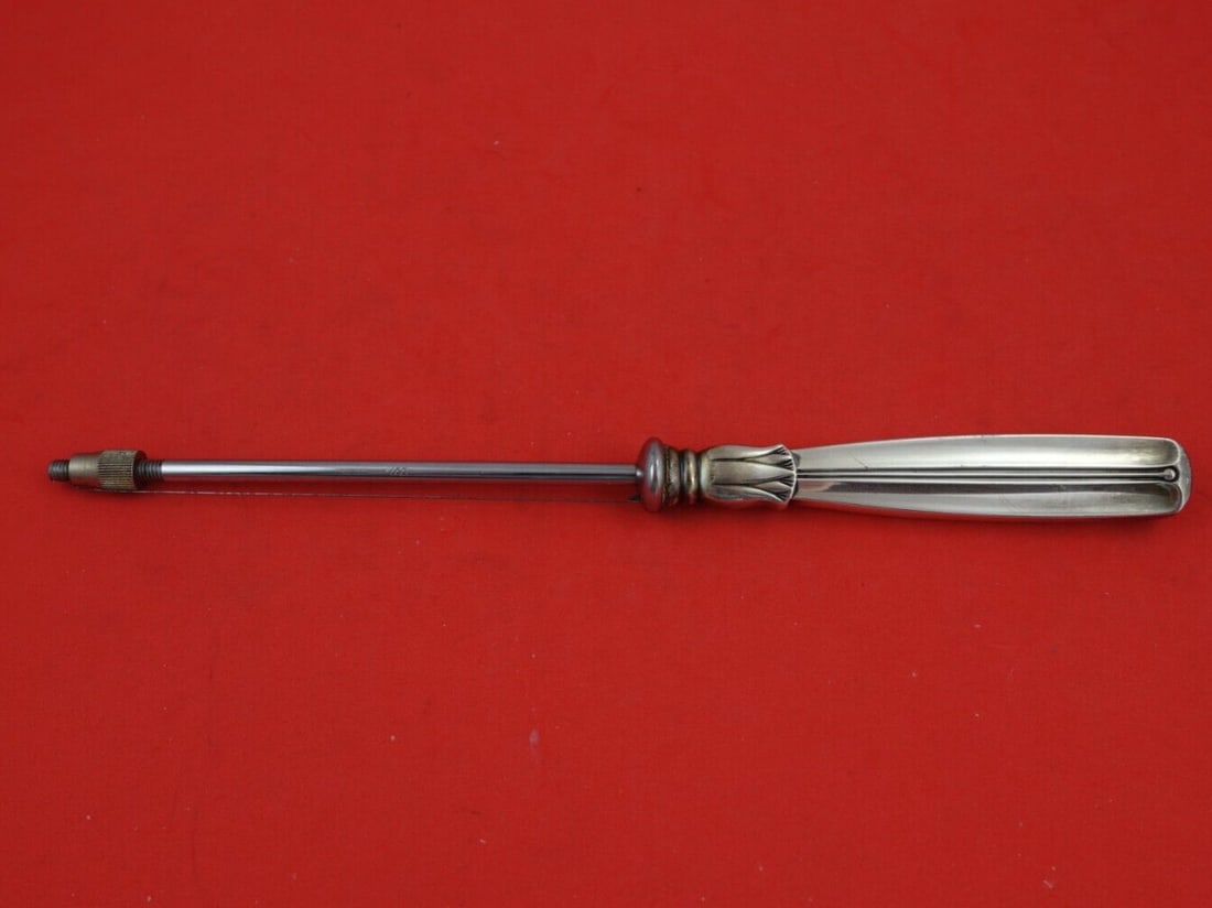 W&S Sorensen Lotus Sterling Silver Cheese Wire 9.5 inches: W&S Sorensen Lotus Sterling Silver Cheese Wire 9.5 inches Presenting the exquisite Lotus cheese wire by W&S Sorensen, a perfect blend of elegance and functionality. Crafted from sterling silver, this