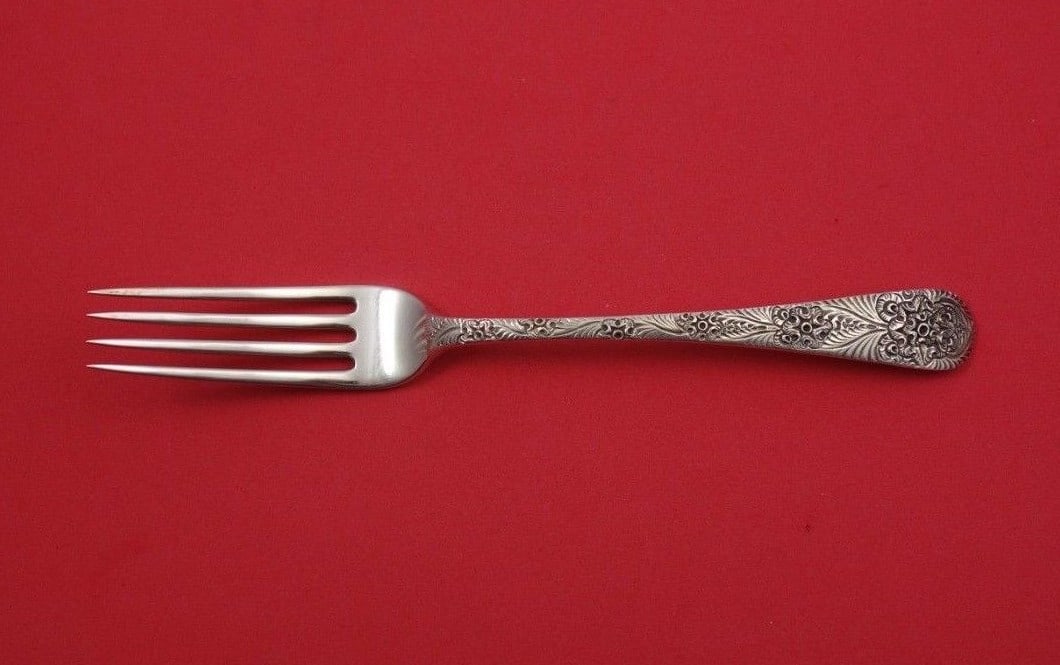 Tiffany & Co Antique Engraved Sterling Silver Fork 7 1/4": Tiffany & Co Antique Engraved Sterling Silver Fork 7 1/4" This exquisite antique fork, crafted by Tiffany & Co., showcases exceptional artistry with its Antique Engraved pattern. Measuring 7 1/4" in l