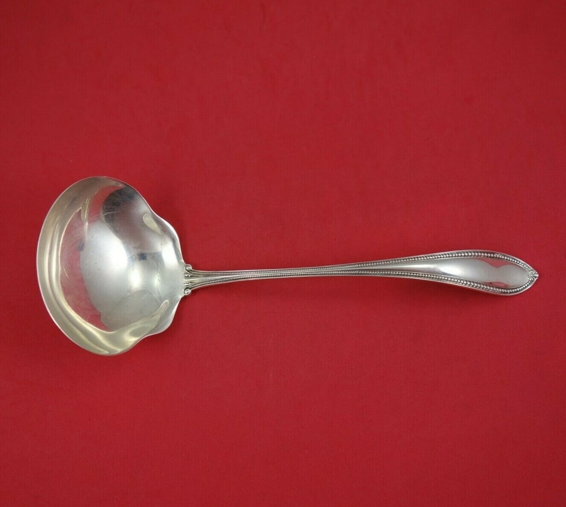 International Sterling Silver Trumbull Oyster Ladle 9 3/4" Antique: International Sterling Silver Trumbull Oyster Ladle 9 3/4" Antique This exquisite oyster ladle, crafted in the Trumbull pattern by International, showcases a beautiful design that embodies the eleganc