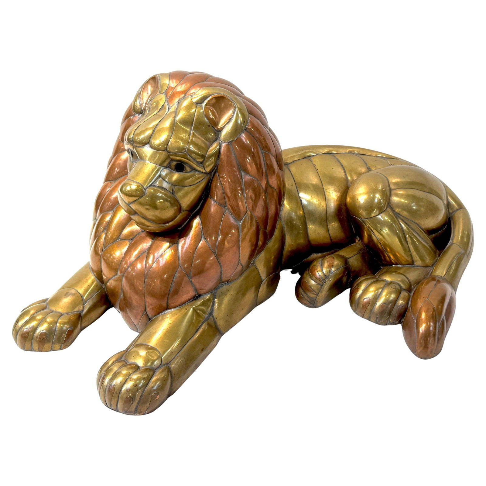 Recumbent Copper and Brass Lion Sculpture Attributed to Sergio Bustamante Mexico 1970s: Recumbent Copper and Brass Lion Sculpture Attributed to Sergio Bustamante Mexico 1970s This large lion sculpture is attributed to Sergio Bustamante and was crafted in Mexico during the late 1970s to e