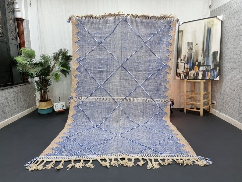 Handwoven Moroccan Rug 100% Sheep Wool 10 x 5 Feet: Handwoven Moroccan Rug 100% Sheep Wool 10 x 5 Feet This fabulous authentic rug is handwoven in the Atlas Mountains by skilled Berber women weavers. Crafted using traditional tools and natural local wo