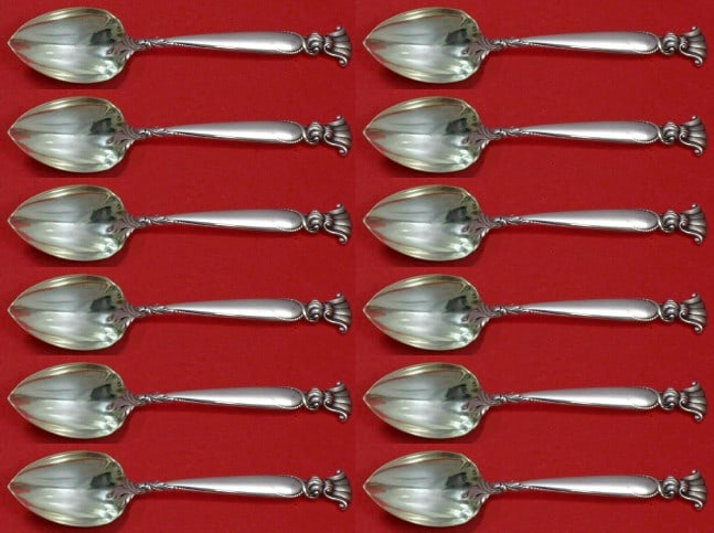 Wallace Romance of the Sea Sterling Silver Spoon Set 12 pcs Custom Fluted Design: Wallace Romance of the Sea Sterling Silver Spoon Set 12 pcs Custom Fluted Design This exquisite set of 12 grapefruit spoons from Wallace showcases the elegant pattern "Romance of the Sea." Crafted fro