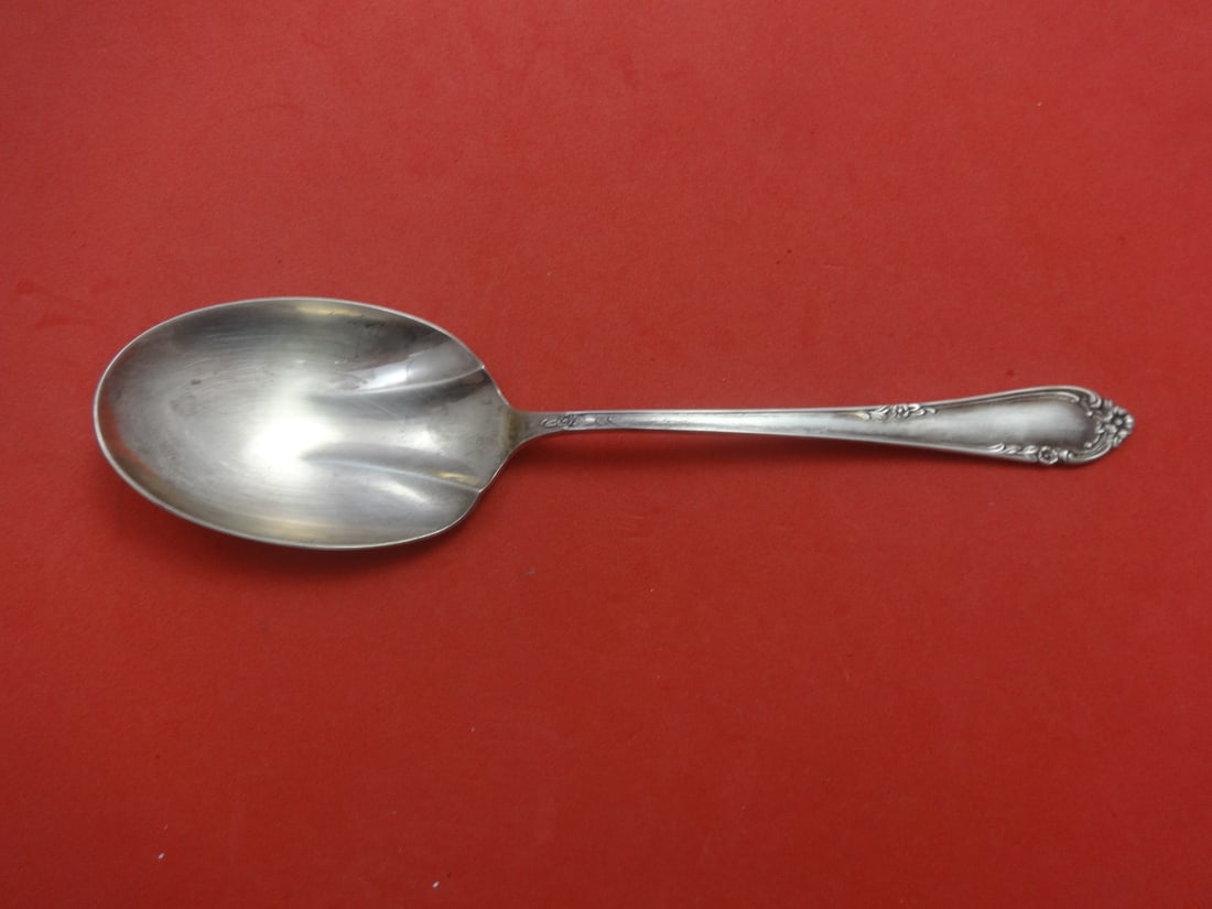 Reed and Barton Dancing Flowers Sterling Silver 9" Serving Spoon: Reed and Barton Dancing Flowers Sterling Silver 9" Serving Spoon This elegant serving spoon, crafted by Reed and Barton, showcases the exquisite Dancing Flowers pattern. Made from high-quality sterlin