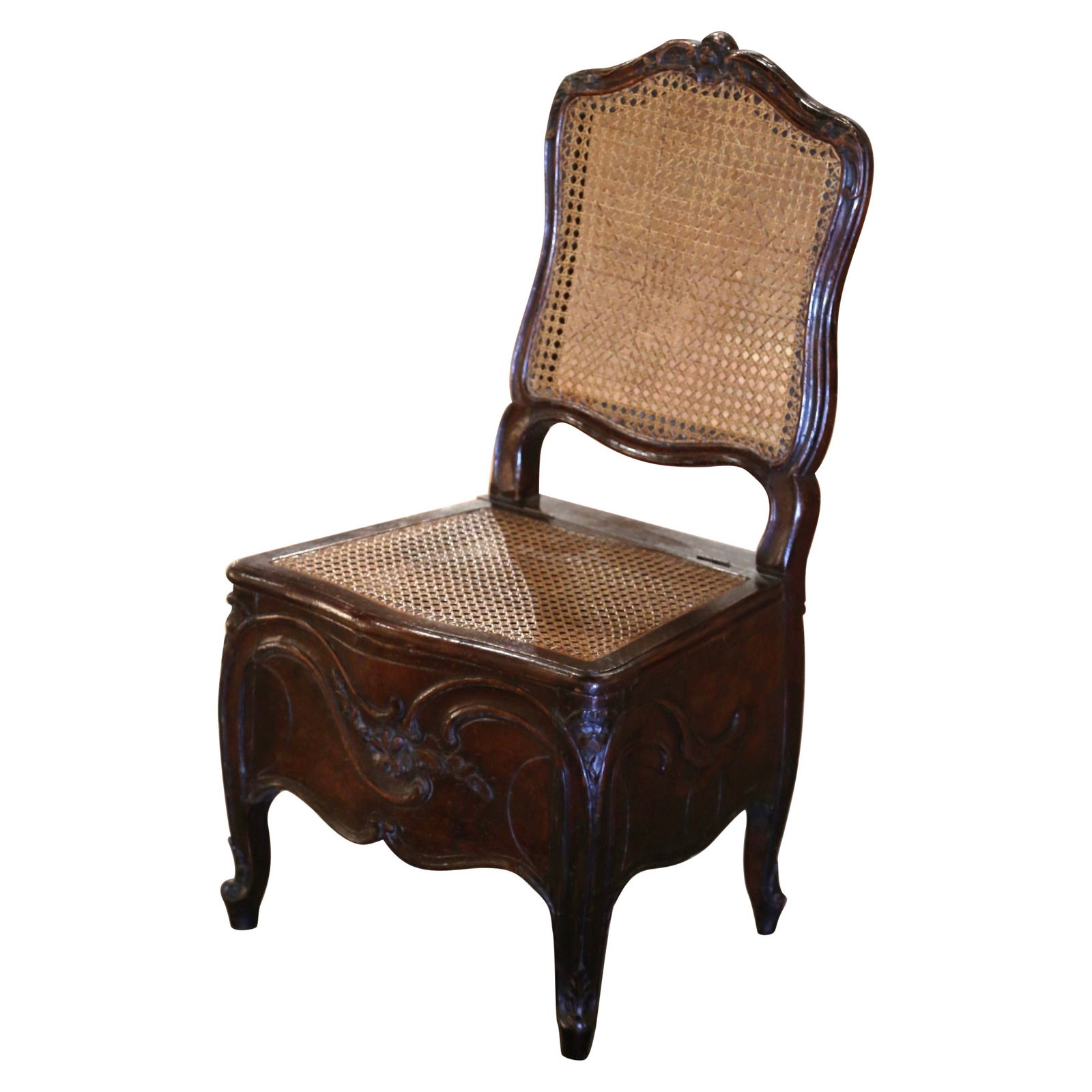 18th Century Louis XV Carved Walnut Cane Potty Chair Commode: 18th Century Louis XV Carved Walnut Cane Potty Chair Commode This exquisite 18th-century French Louis XV "Potty" chair is a stunning example of mid-18th century craftsmanship. Constructed from rich wa