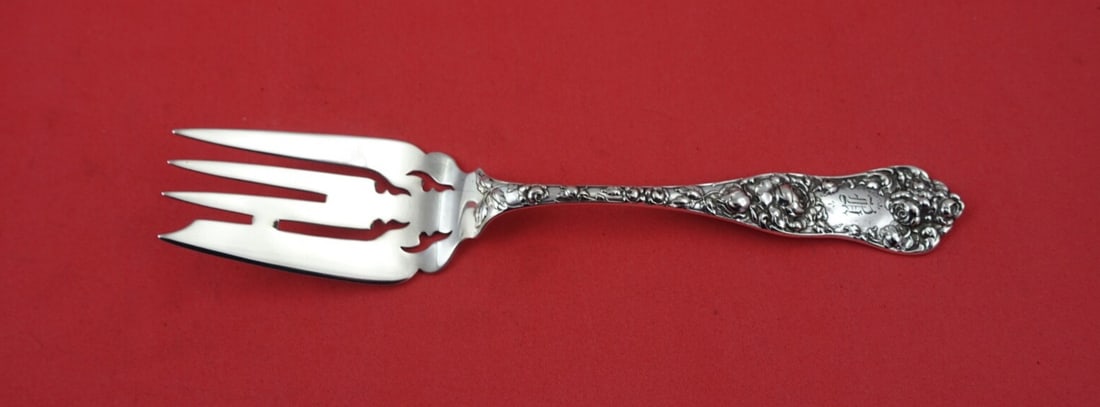 Shiebler American Beauty Sterling Silver Pierced Serving Fork 8 1/4": Shiebler American Beauty Sterling Silver Pierced Serving Fork 8 1/4" This exquisite cold meat fork showcases the American Beauty pattern by Shiebler, crafted from high-quality sterling silver. Measuri