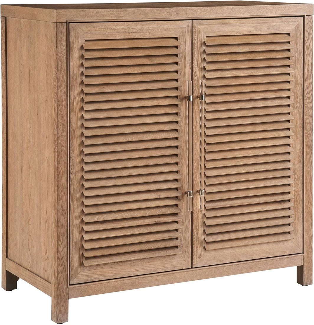 Universal Weekender Coastal Living Bar Cabinet Sand Dune Finish: Universal Weekender Coastal Living Bar Cabinet Sand Dune Finish Elevate your coastal living space with this elegant bar cabinet from the Weekender Coastal Living Home Collection. Designed to blend sea