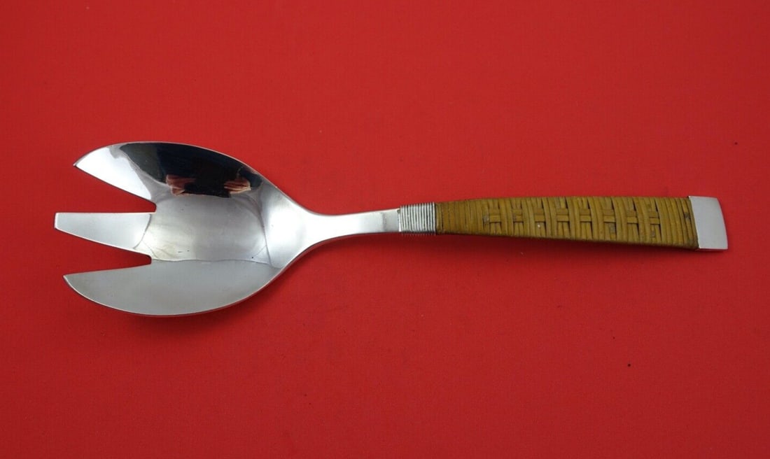 Harry Osaki Sterling Silver Salad Fork with Wire Wrap 10.5": Harry Osaki Sterling Silver Salad Fork with Wire Wrap 10.5" This exquisite salad serving fork by Harry Osaki is crafted from sterling silver, showcasing a unique wire wrap and faux wicker banding alon