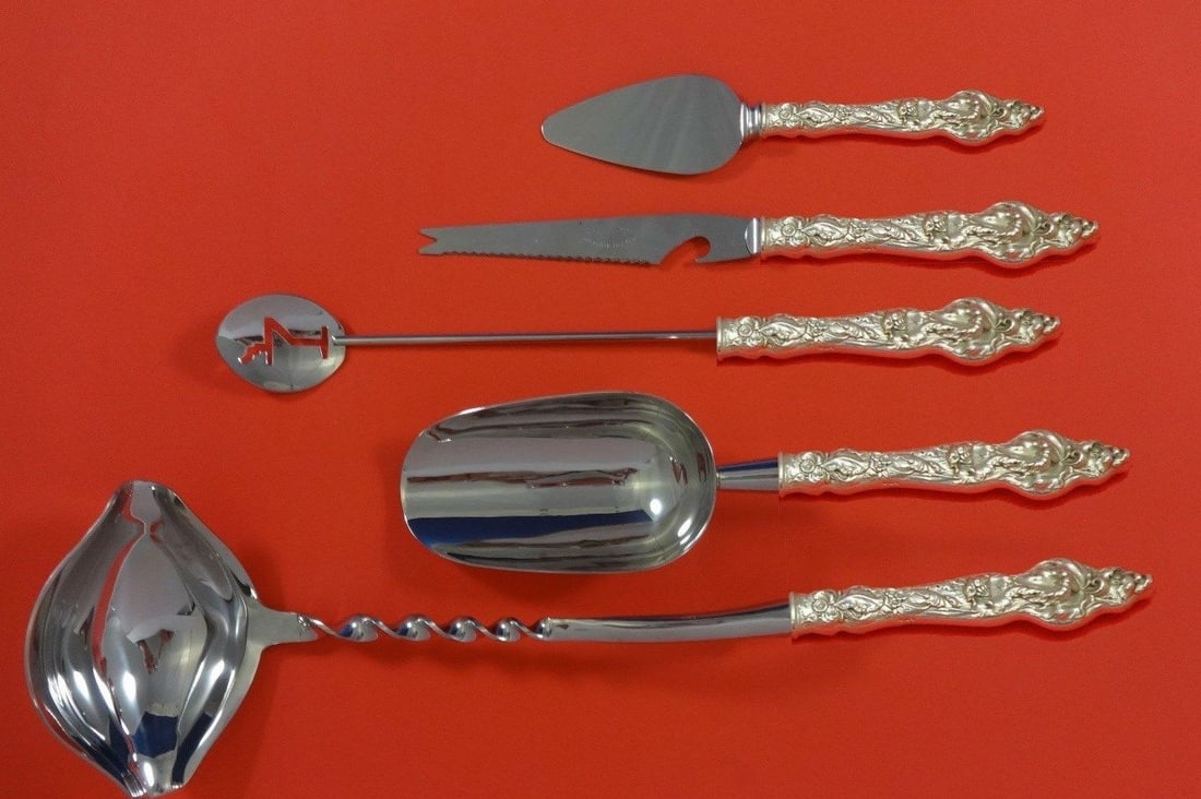 Reed & Barton Les Six Fleurs Sterling Silver 5-Piece Cocktail Bar Set: Reed & Barton Les Six Fleurs Sterling Silver 5-Piece Cocktail Bar Set Elevate your cocktail gatherings with this exquisite Les Six Fleurs Hostess Set by Reed & Barton. Crafted in sterling silver, this