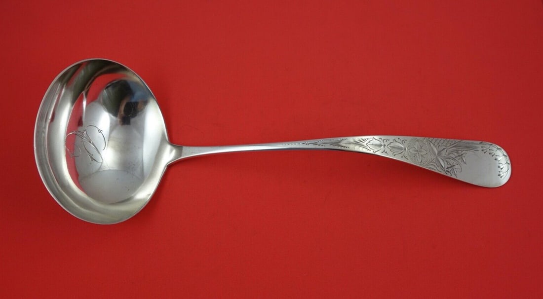 Whiting Antique Lily Engraved Sterling Silver Soup Ladle 13": Whiting Antique Lily Engraved Sterling Silver Soup Ladle 13" This exquisite Antique Lily Engraved Soup Ladle is crafted from high-quality sterling silver and showcases a beautiful design that reflects