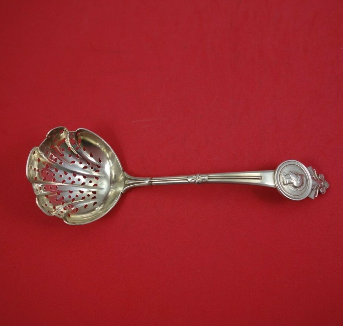 Gorham Medallion Sterling Silver Sugar Sifter Ladle 8 1/4 Antique: Gorham Medallion Sterling Silver Sugar Sifter Ladle 8 1/4 Antique This exquisite sugar sifter ladle is crafted from sterling silver and features the elegant Medallion pattern by Gorham. Measuring 8 1/