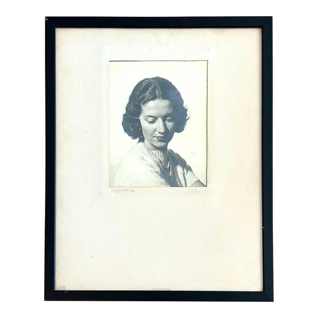 Meditation Black and White Portrait Photograph of Woman Framed: Meditation Black and White Portrait Photograph of Woman Framed This vintage black-and-white portrait photograph, titled 'Meditation,' features a poised woman in a moment of quiet reflection. The compo