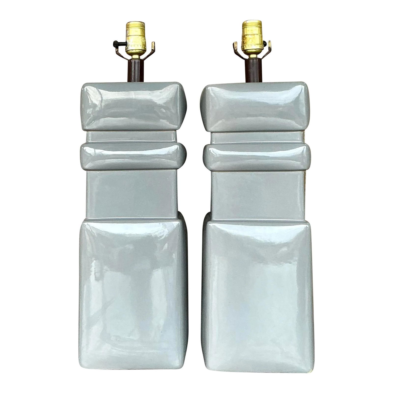 Pair of Vintage Mid-Century Modern Gray Ceramic Lamps: Pair of Vintage Mid-Century Modern Gray Ceramic Lamps Enhance your space with this striking pair of vintage mid-century modern glazed ceramic lamps. Showcasing a bold geometric silhouette and a glossy